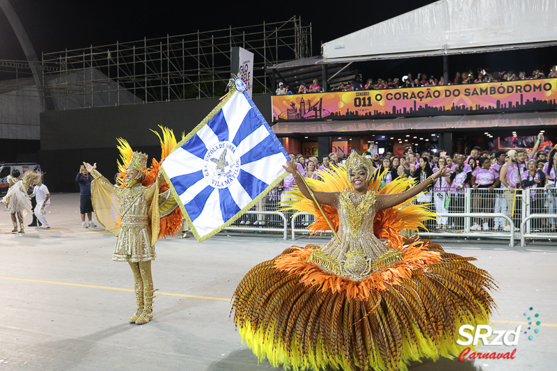 Casal de mestre-sala e porta-bandeira comunica saída da Nenê de Vila Matilde